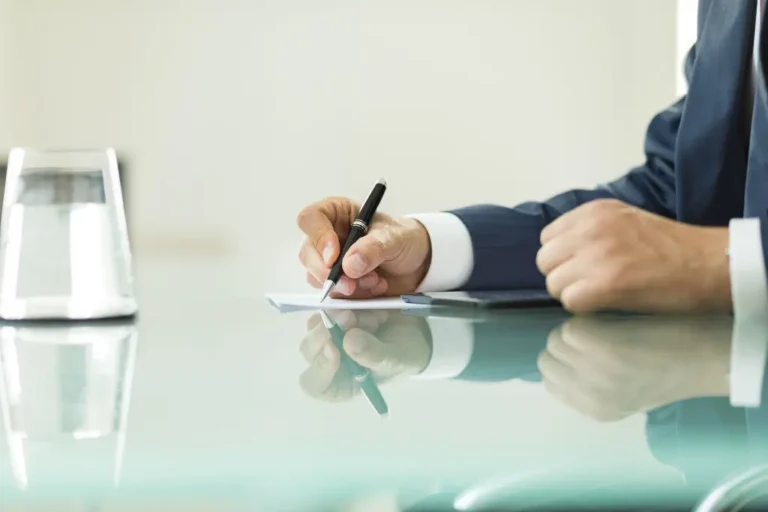 Divorce lawyer taking notes during a meeting